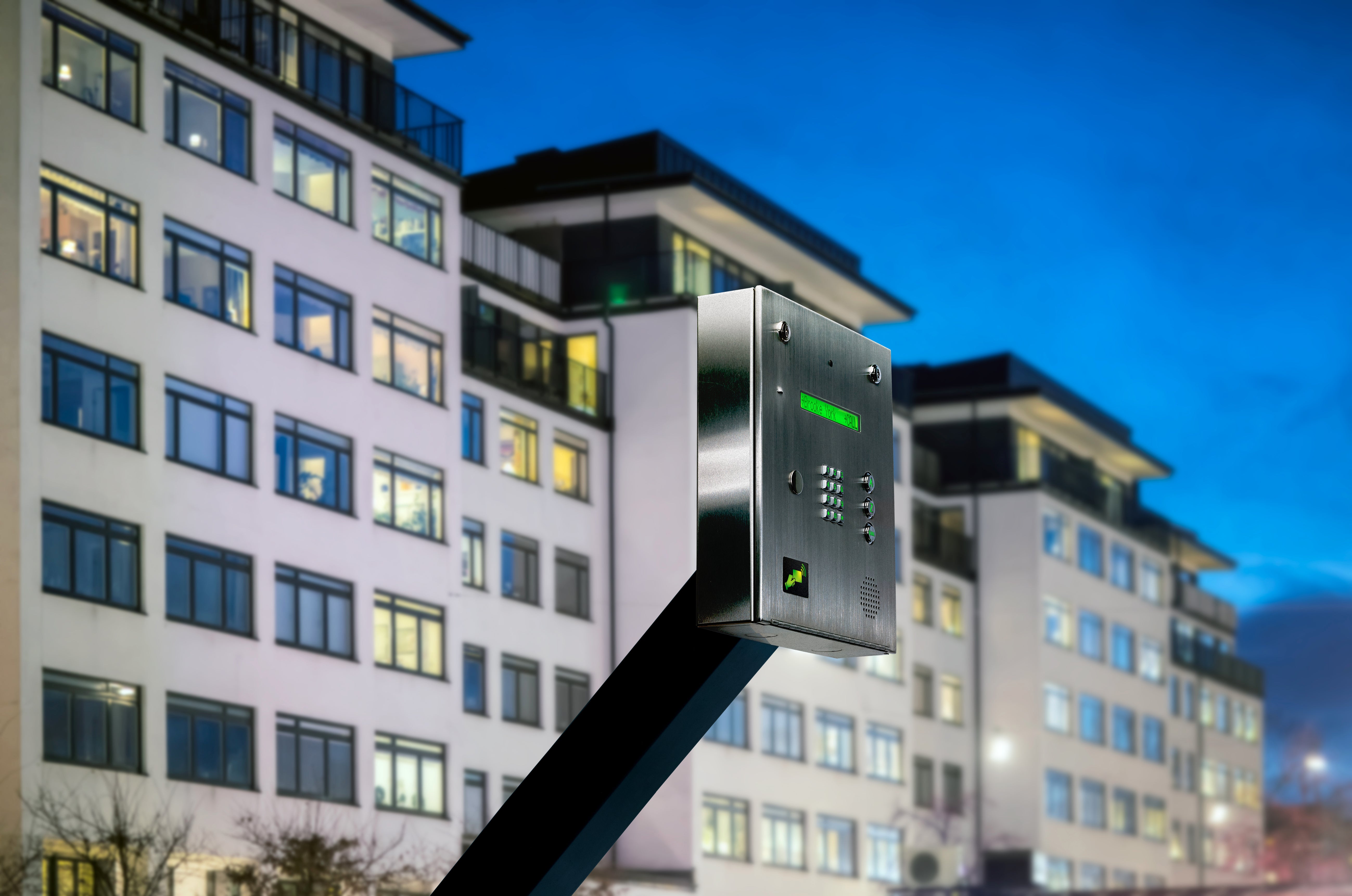 exterior photo of an access control gat box in front of an apartment complex