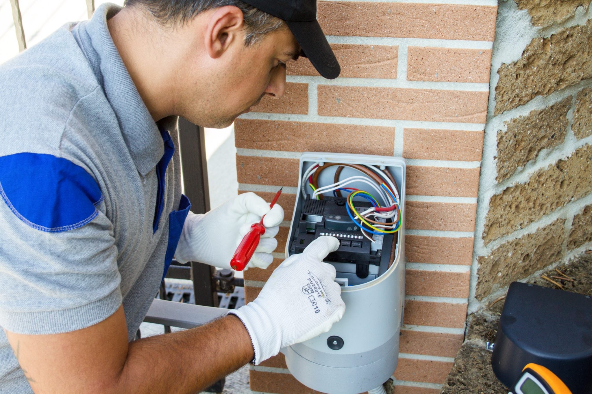 photo of a gate operator working on a gate operator